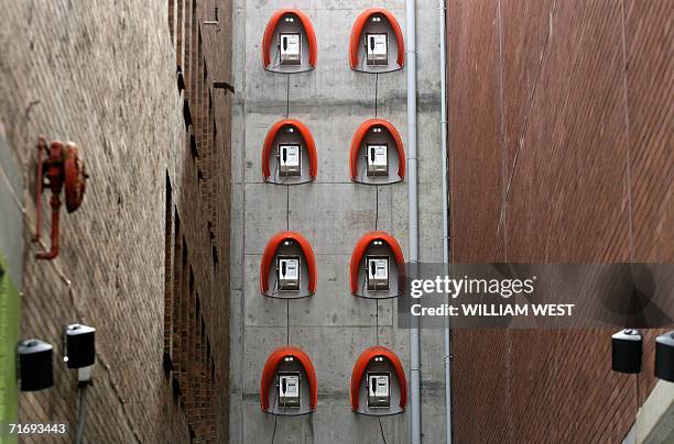 Phone boxs are attached high on awall as an art installation to brighten up laneways in central Melbourne, 22 August 2006. The Australian cabinet met...