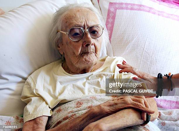 Marie-Simone Capony is pictured, 22 August 2006 at home in Cannes, south eastern France. This 112-year-old woman has become France's oldest citizen,...