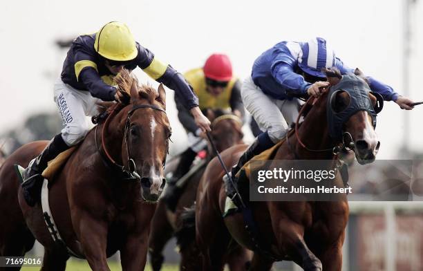 Ryan Moore and Notnowcato get the better of the Richard Hills ridden Maraahel to land The Juddmonte International Stakes Race run at York Racecourse...