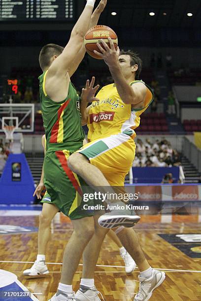Jason Smith of Australia shoots against Lithuania during the preliminary round of FIBA World Championships 2006 on August 23, 2006 in Hamamatsu,...