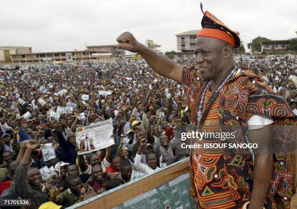 This file picture dated 10 October 2004 shows John Fru Ndi, opposition party candidate for the Social Democratic front waving to supporters at a...