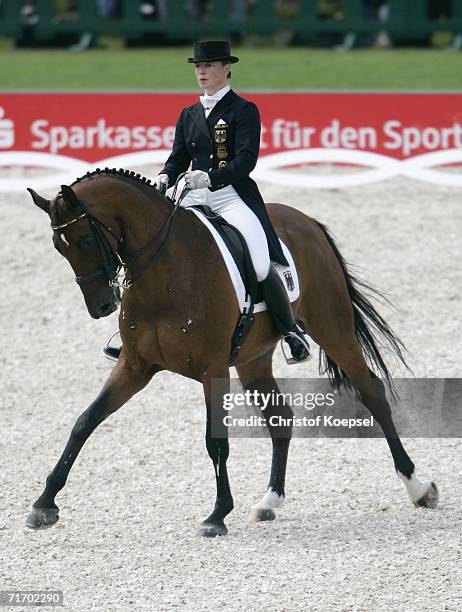 Isabelle Werth of Germany rides on Satchmo during the second day of the Dressage Grand Prix and Team Final at the World Equestrian Games on August...