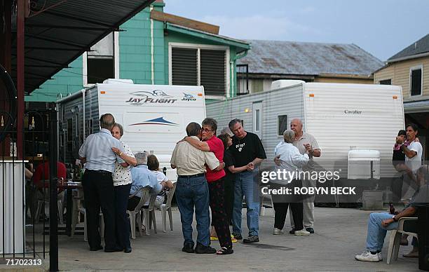 New Orleans, UNITED STATES: Patrons dance to live music in a courtyard beside emergency shelter trailers, at the Parkway Bakery and Tavern in New...