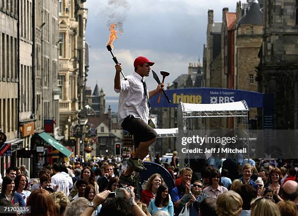 Street entertainers perform on the Royal Mile as part of the Fringe during the Edinburgh Festival on August 23, 2006 in Edinburgh, Scotland.