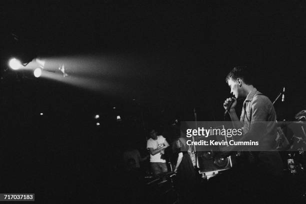 Singer and guitarist Bernard Sumner performing with English rock group New Order at the Ritz, Manchester, 26th October 1981.