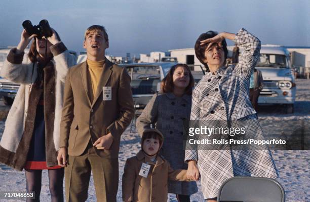 View of the family of American astronaut Jim Lovell, including his wife Marilyn Lovell and children Barbara, James, Jeffrey and Susan, as they watch...