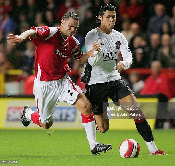 Cristiano Ronaldo of Manchester United clashes with Luke Young of Charlton Athletic during the Barclays Premiership match between Charlton Athletic...