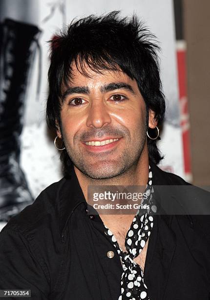 Musician Alex Gonzalez of Mana signs copies of their new CD "Amar Es Combatir" at Virgin Megastore Times Square on August 23, 2006 In New York City.