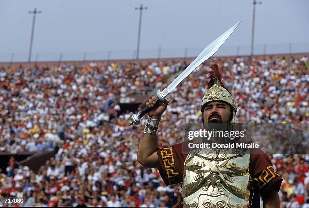 The USC Trojans mascot cheers from the sidelines durnig a game against the Arizona Wildcats at the Coliseum in Los Angeles, California. The Wildcats...