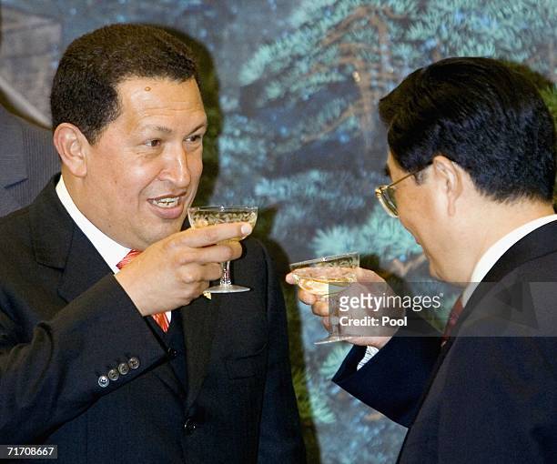 Venezuelan President Hugo Chavez toasts Chinese President Hu Jintao as they attend a signing ceremony at the Great Hall of the People on August 24,...
