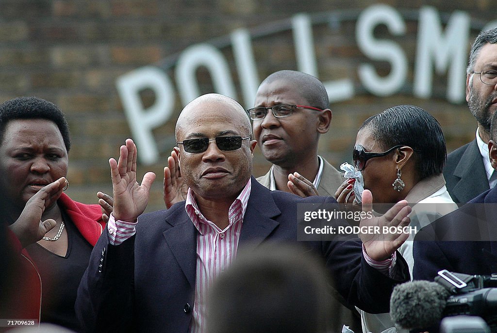 Tony Yengeni, in dark jacket, and sungla