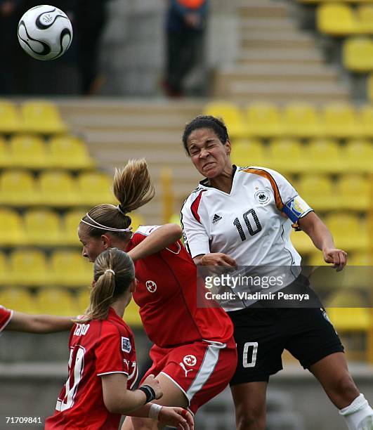 Celia Okoyino Da Mbabi of Germany tackles Vanessa Buerki of Switzerland during the FIFA Women's Under 20 World Championships Group C match between...