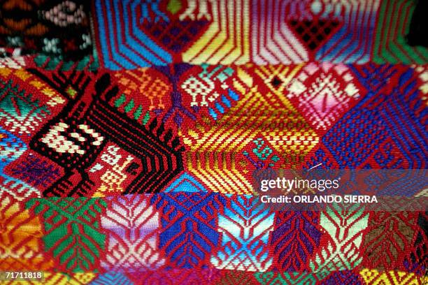 Guatemala City, GUATEMALA: Pieces of cloth from the Mayan civilization, found at Concepcion Chiquirichapa in the department of Quetzaltenango are...