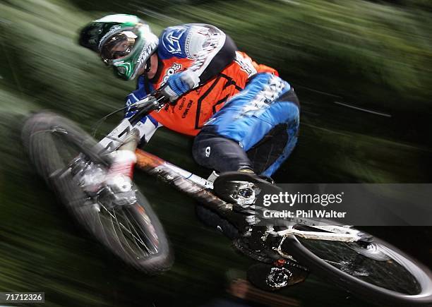 Claudio Cozzi of Italy takes to the air during a downhill training run on the slopes of Mount Ngongotaha on day four of the Mountain Bike World...