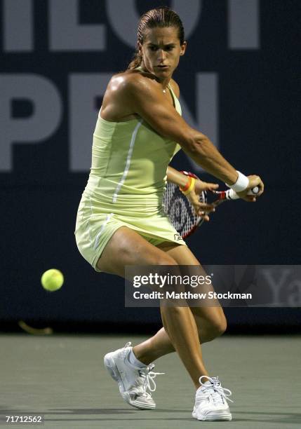 Amelie Mauresmo of France returns a shot to Lindsay Davenport during the Pilot Pen Tennis tournament August 24, 2006 at the Connecticut Tennis Center...