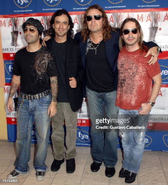 Musicians Alex Gonzalez, Juan Calleros, Fher Olvera and Sergio Vallin of Mana pose for a photo before signing copies of their new CD "Amar Es...