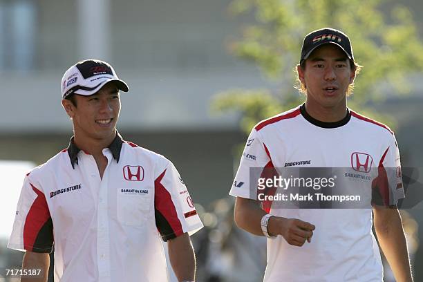 Takuma Sato of Japan and Super Aguri F1 with team mate Sakon Yamamoto of Japan in the paddock after second practice for the Turkish Formula One Grand...
