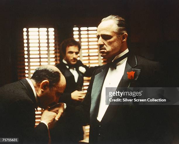 From left to right, Salvatore Corsitto as Bonasera, James Caan as Santino 'Sonny' Corleone and Marlon Brando as Don Vito Corleone in 'The Godfather',...