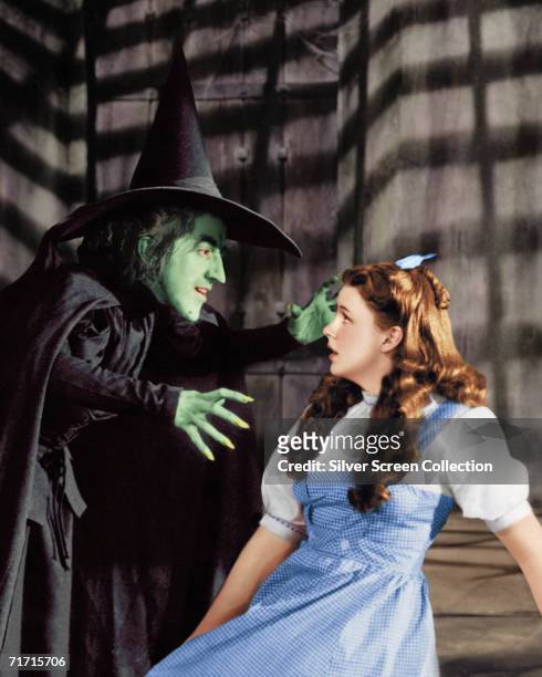 Margaret Hamilton as the Wicked Witch and Judy Garland as Dorothy Gale in 'The Wizard of Oz', 1939.