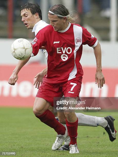 Regis Dorn of Offenbach competes with Christian Eichner of Karlsruhe during the Second Bundesliga match between Kickers Offenbach and Karlsruher SC...