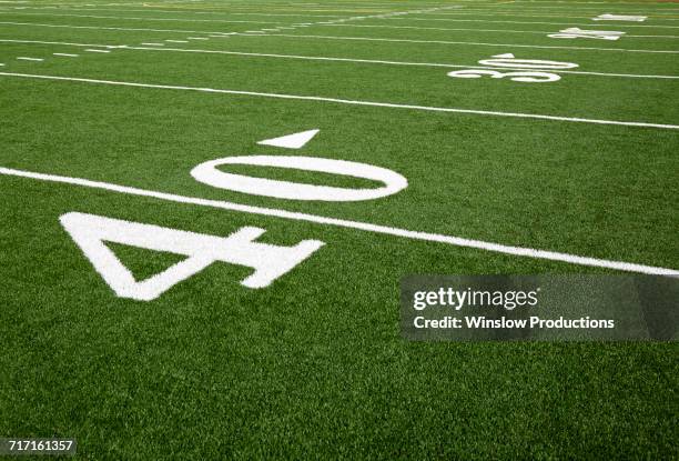 football field marking of 40 yard line - yard line stock-fotos und bilder