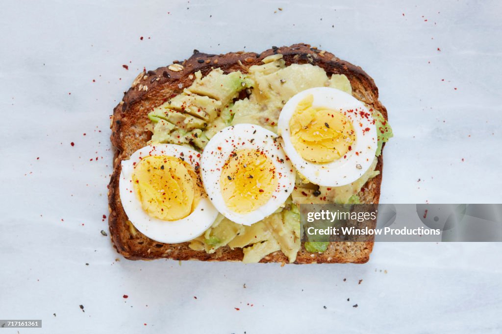 Toasted bread with avocado and hard boiled egg