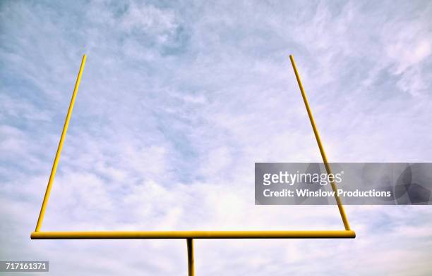 low angle view of american football goal post - football goal post stock pictures, royalty-free photos & images