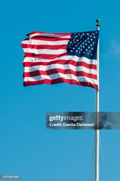 american flag against clear sky at fort macon state park, atlantic beach, north carolina, usa - atlantic beach north carolina fotografías e imágenes de stock