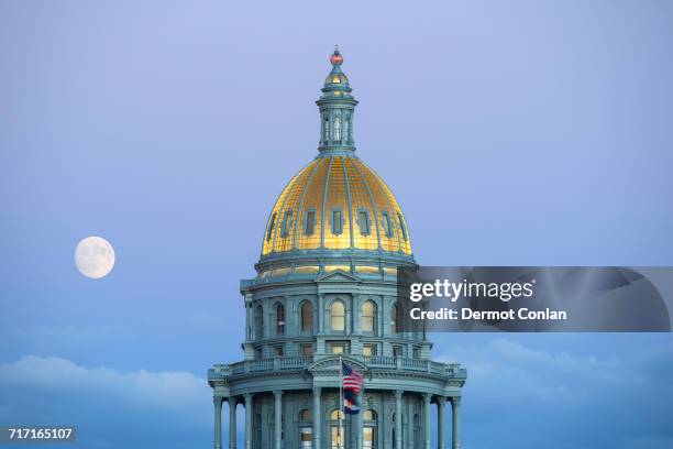 usa, colorado, denver, full moon rising next to state capitol dome - denver landmarks stock pictures, royalty-free photos & images