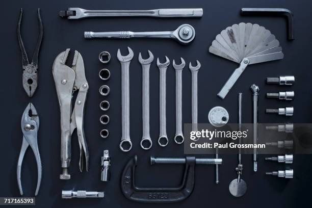 studio shot of work tools on black background - knolling tools stock-fotos und bilder