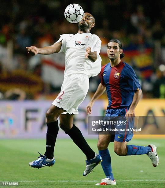 Frederic Kanoute of Sevilla tussels for the ball with Rafael Marquez of Barcelona during the UEFA Super Cup between FC Barcelona and FC Sevilla at...