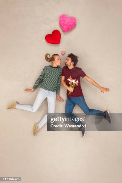 couple in love with a bunch of flowers - couple flowers stock pictures, royalty-free photos & images