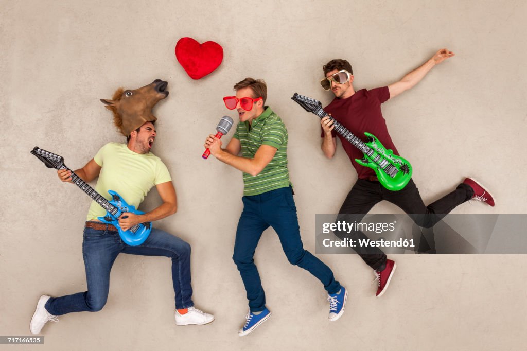 Friends playing music in a rock band
