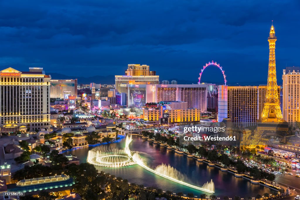 USA, Nevada, Las Vegas, Strip, fountain, hotels and Eiffel Tower at blue hour