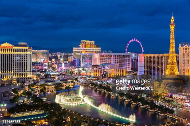 usa, nevada, las vegas, strip, fountain, hotels and eiffel tower at blue hour - las vegas stock pictures, royalty-free photos & images
