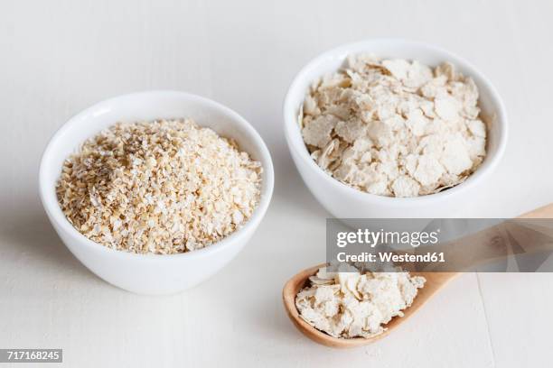 bowls of oat bran and oat bran flakes - kli bildbanksfoton och bilder