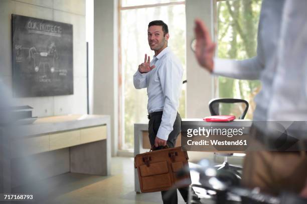 colleagues saying good bye after a meeting - leaving office stock pictures, royalty-free photos & images
