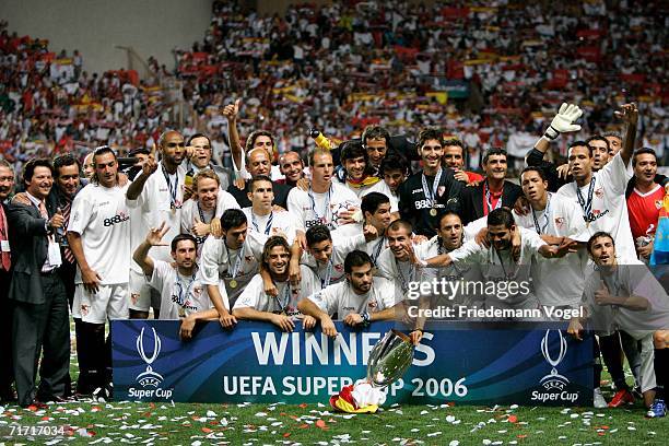 The team of Sevillia celebrates after winning the UEFA Super Cup between FC Barcelona and FC Sevilla at the Stadium Louis II on August 25, 2006 in...