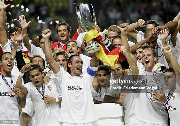 The team of Sevillia celebrates after winning the UEFA Super Cup between FC Barcelona and FC Sevilla at the Stadium Louis II on August 25, 2006 in...