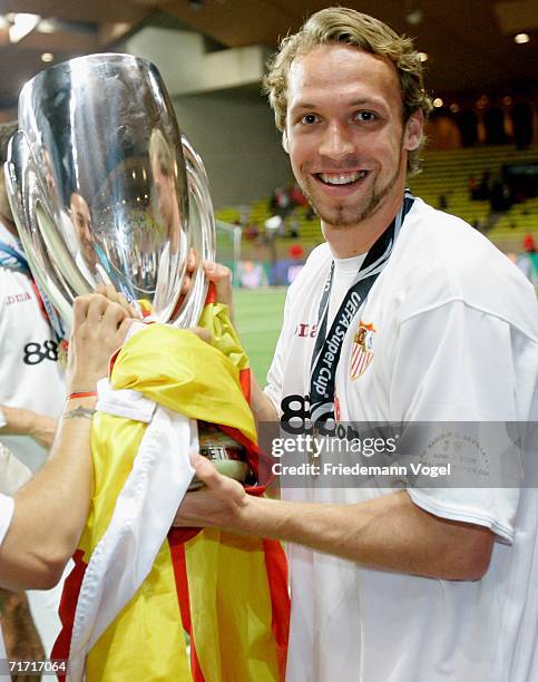 Andreas Hinkel of Sevillia celebrates after winning the UEFA Super Cup between FC Barcelona and FC Sevilla at the Stadium Louis II on August 25, 2006...