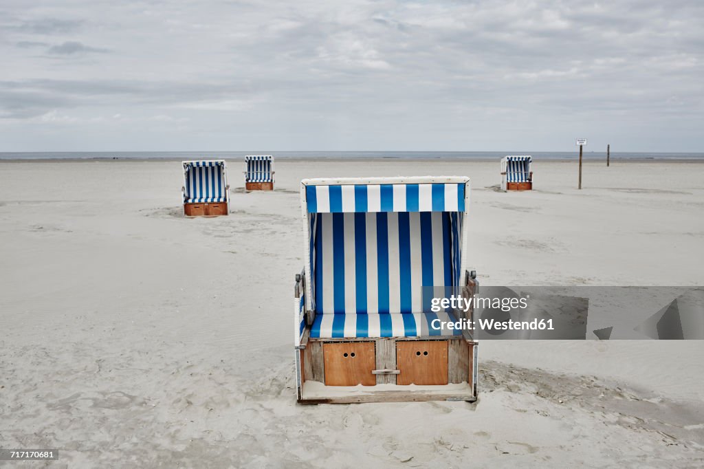 Germany, Schleswig-Holstein, St Peter-Ording, hooded beach chair
