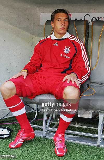 Lukas Podolski of Munich sits on the bench during the Bundesliga match between FC Bayern Munich and 1.FC Nuremberg at the Allianz Arena on August 26,...
