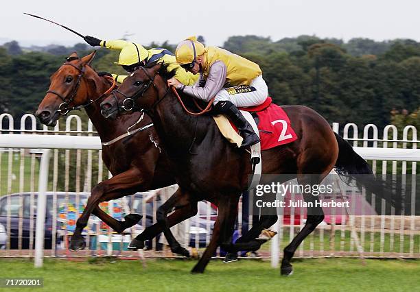 Joe Fanning and Drumfire get the better of the Steve Drowne ridden Danebury Hill to land The IVECO Daily Solario Stakes Race run at Sandown Park...