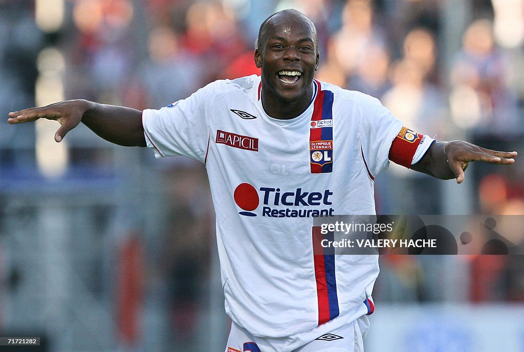 Lyon forward Sylvain Wiltord celebrates