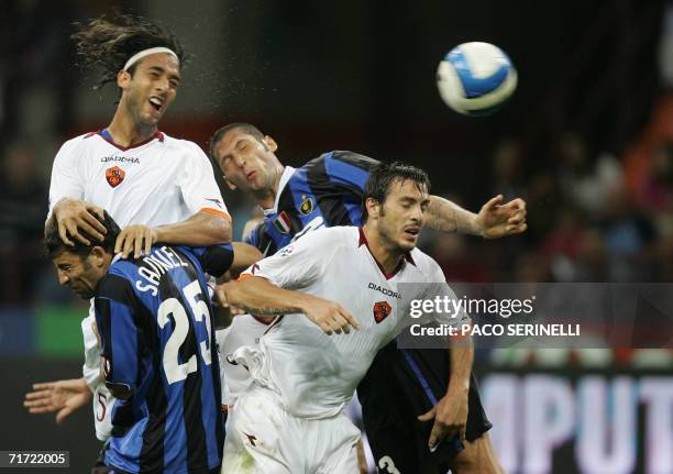 Inter Milan's defenders Walter Samuel and Marco Materazzi fight for the ball with AS Roma's Hossam Hussein Mido and Marco Cassetti during their...