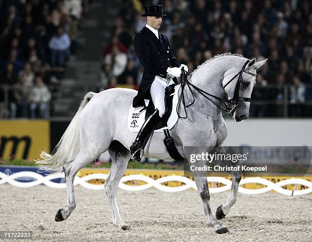 Andreas Helgstrand of Denmark rides on Blue Hors Matinee during the Dressage Grand Prix Freestyle at the World Equestrian Games on August 26, 2006 in...