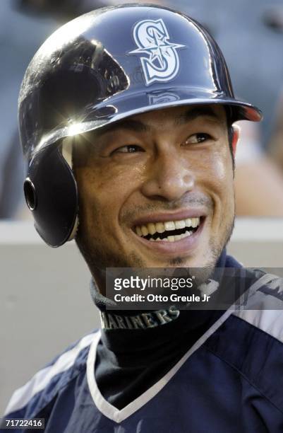 Ichiro Suzuki of the Seattle Mariners smiles while signing autographs prior to the game against the Boston Red Sox on August 26, 2006 at Safeco Field...