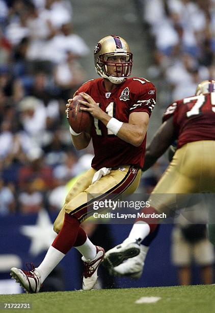 Alex Smith of the San Francisco 49ers passes the ball against the Dallas Cowboys during a preseason game on August 26, 2006 at Texas Stadium in...