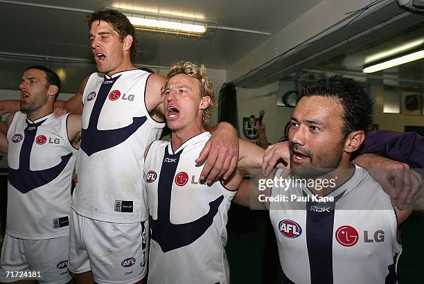 Shane Parker, Aaron Sandilands, Shaun McManus and Peter Bell of the Dockers sing the club song after winning the round 21 AFL match between the West...