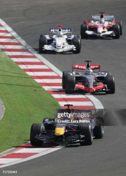 Christian Klien of Austria and Red Bull Racing in action infront of Pedro de la Rosa of Spain and McLaren-Mercedes, Nick Heidfeld of Germany and BMW...
